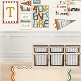Children's room with colorful wall art, storage bins, and a rug.